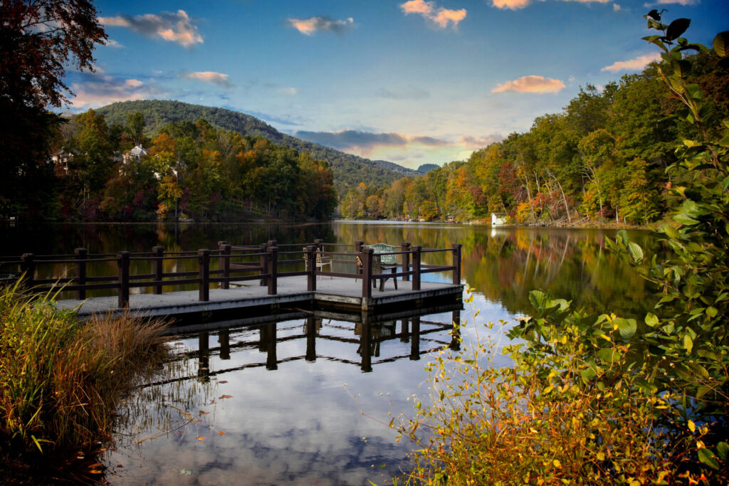 Lake Lure in fall — pier with autumn foliage at Rumbling Bald Resort