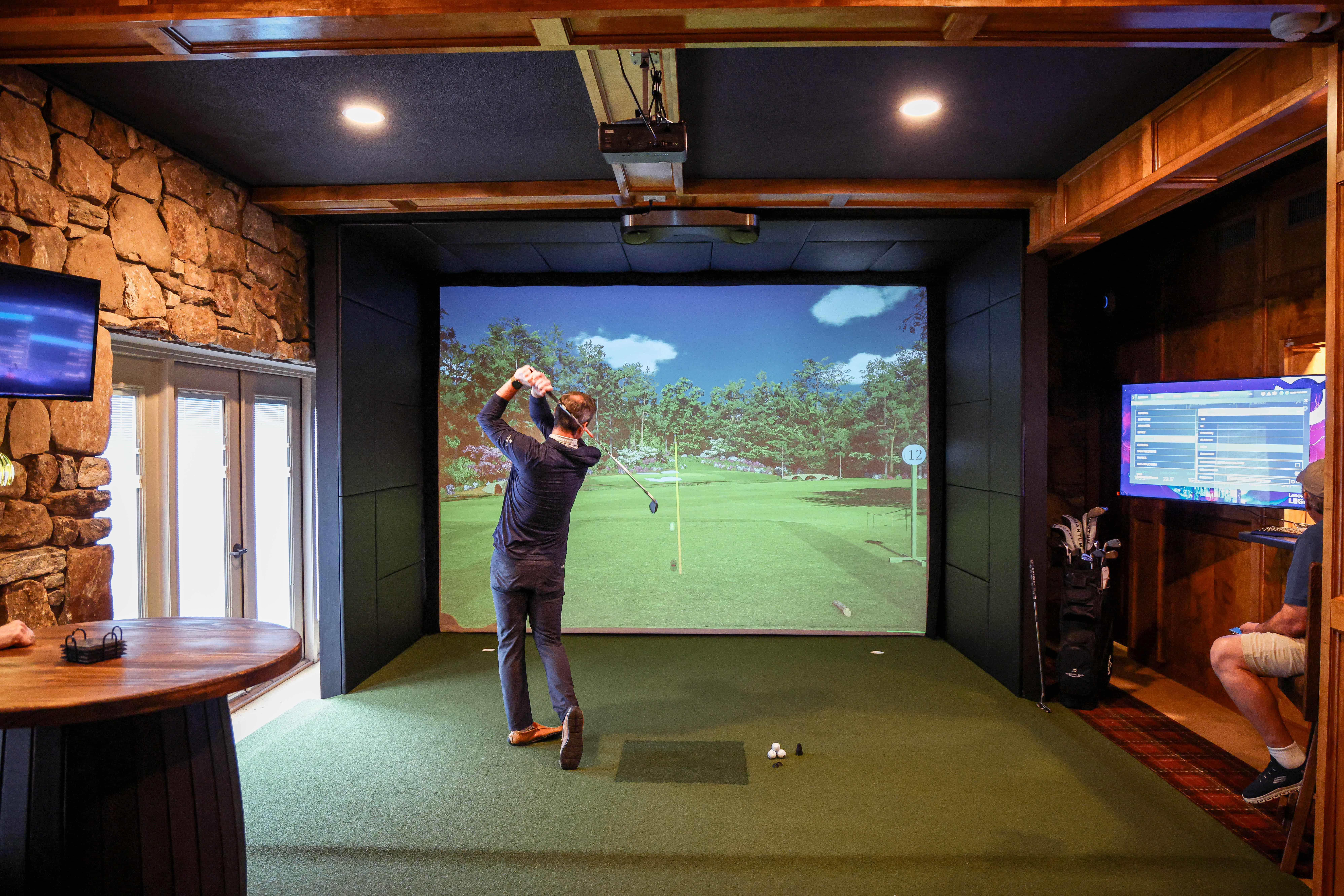 Indoor golf simulator at Rumbling Bald Resort